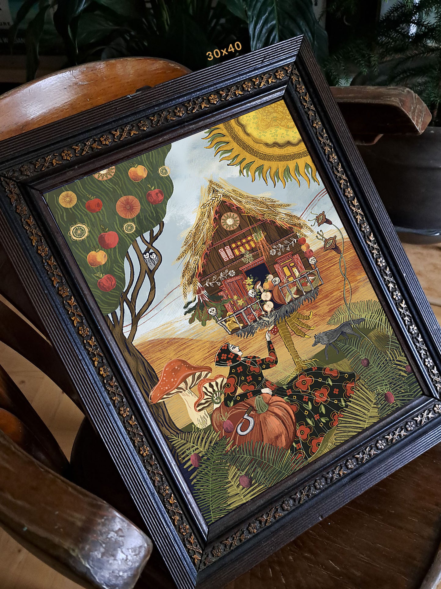 Detal ilustracji „Jagowe Dożynki" – zbliżenie na Babę Jagę z dynią i roślinami przy chatce na kurzej nóżce, folk art print